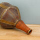 Old terracotta and brass bottle