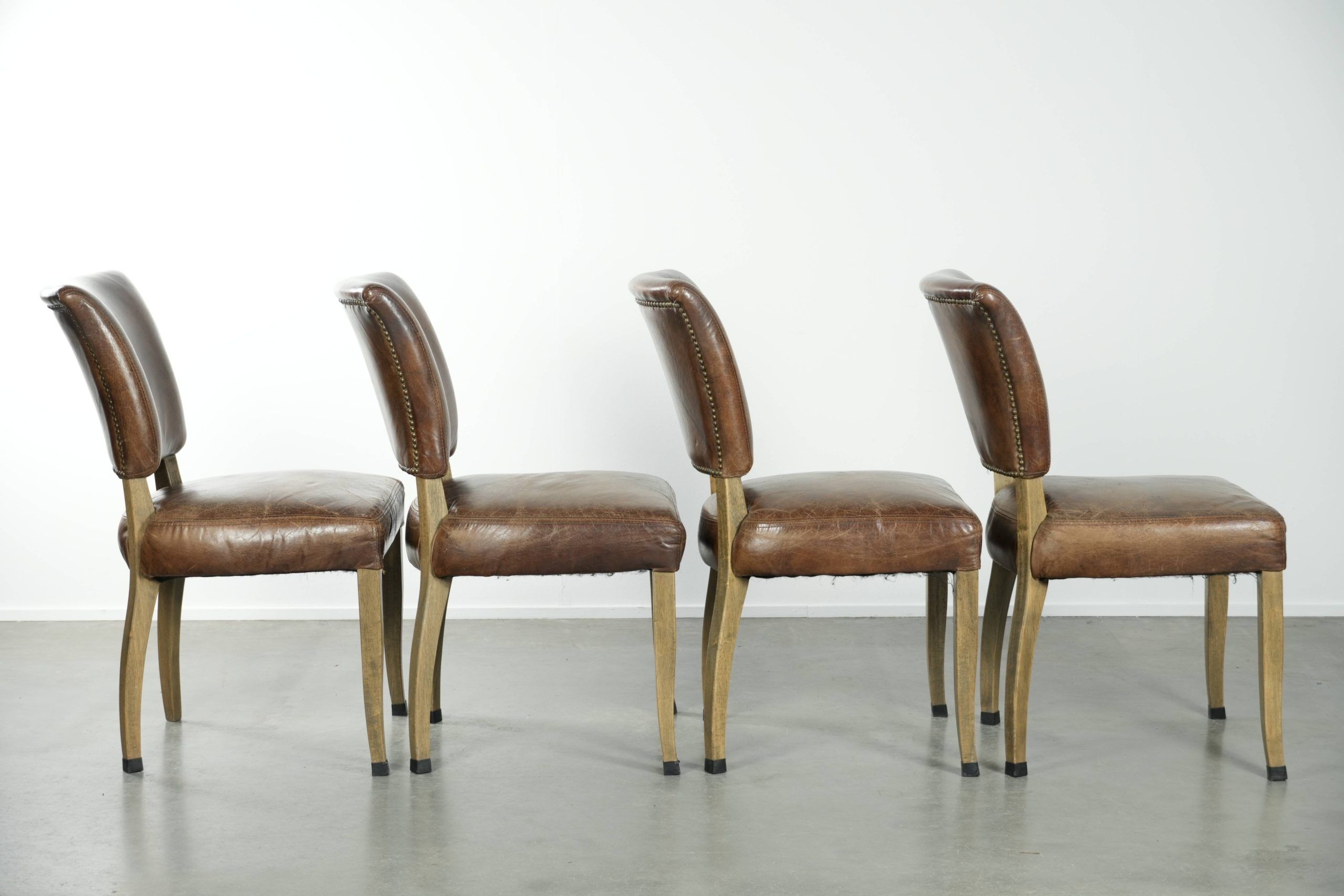 Set of 4 vintage cowhide and wooden dining chairs