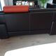 Two brown leather Crozatier two-and-a-half-seater sofas.