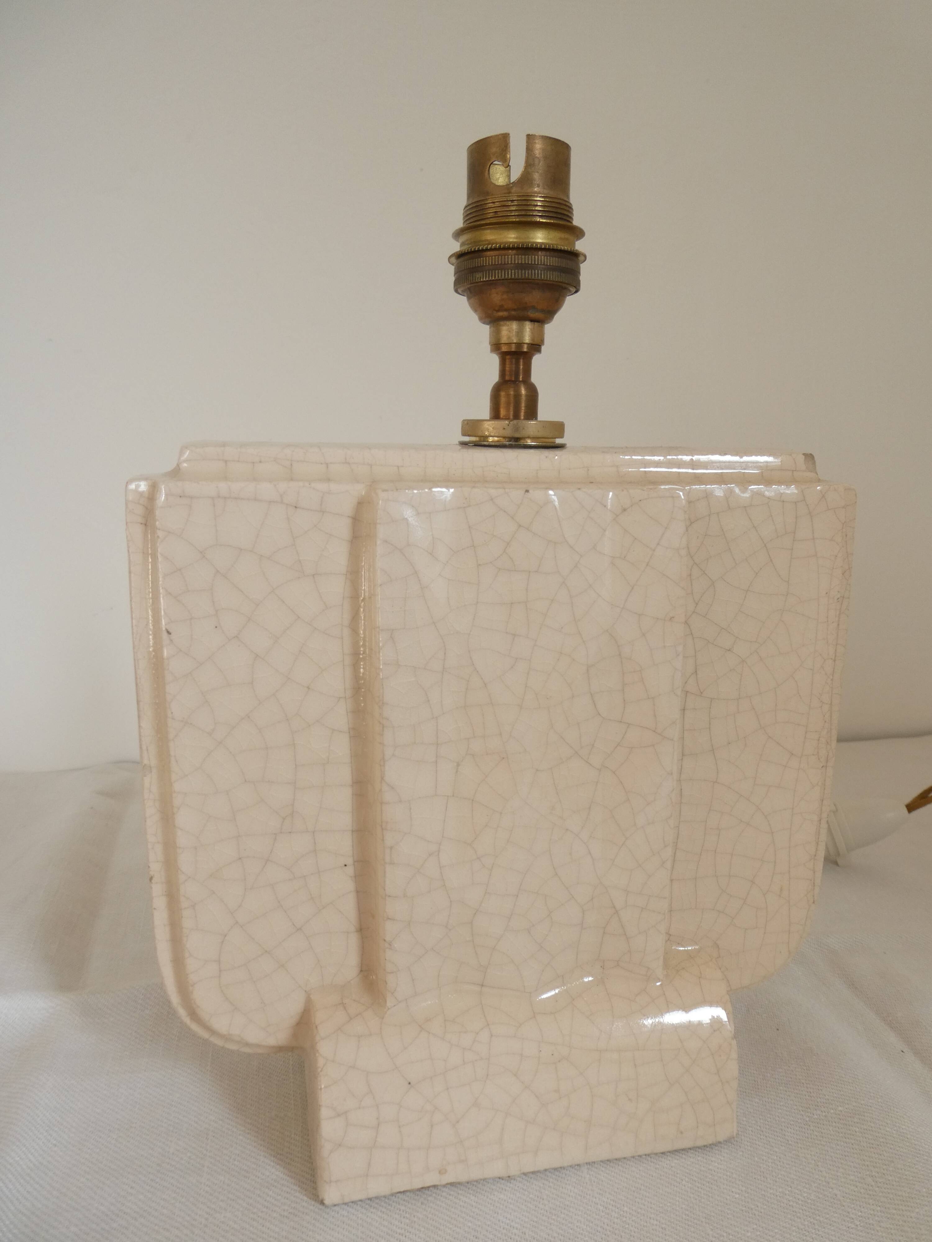 Cream cracked ceramic lamp base in Scandinavian style.