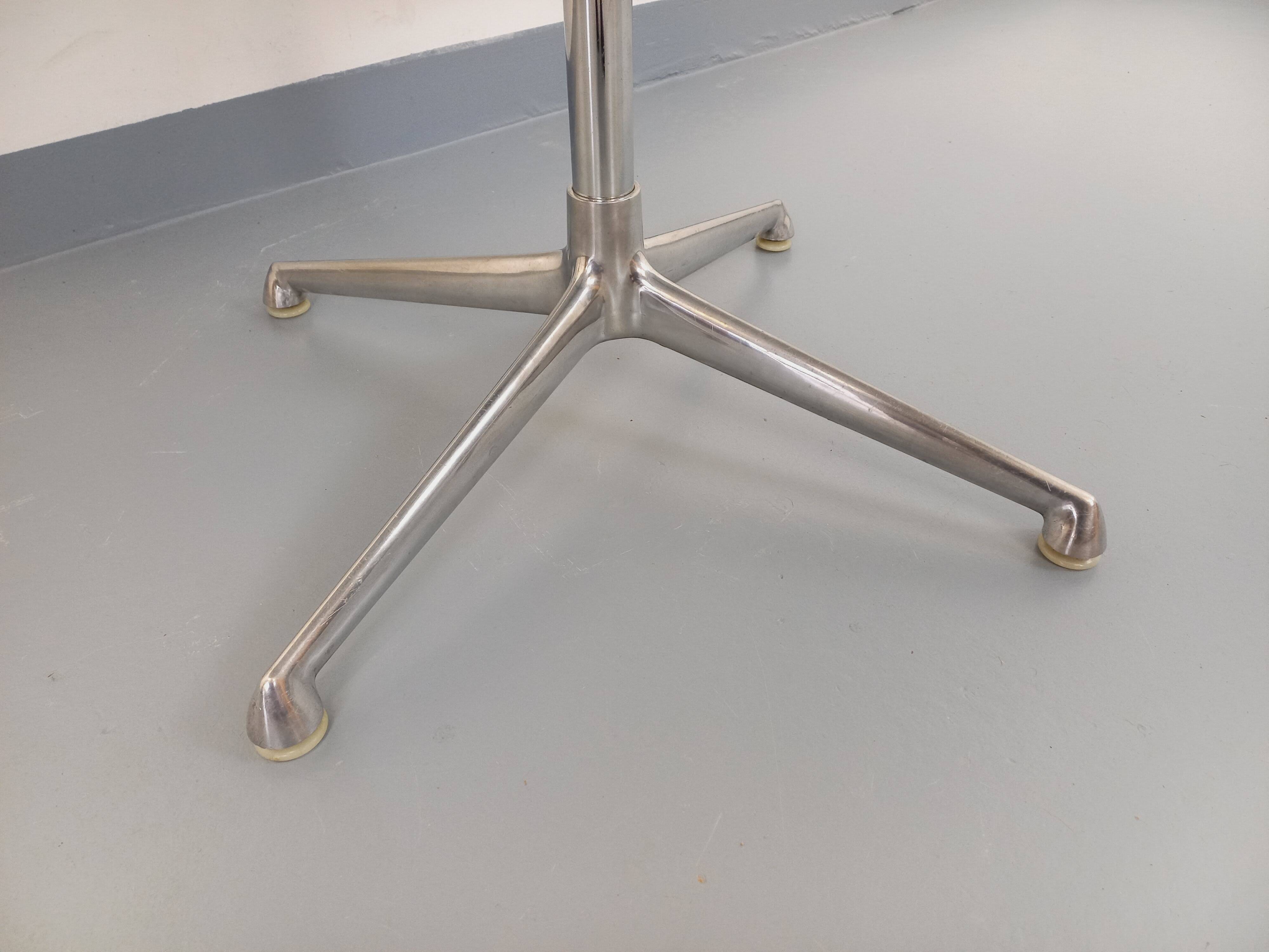 Vintage Eames round table for Vitra in white melamine, wood, and metal.