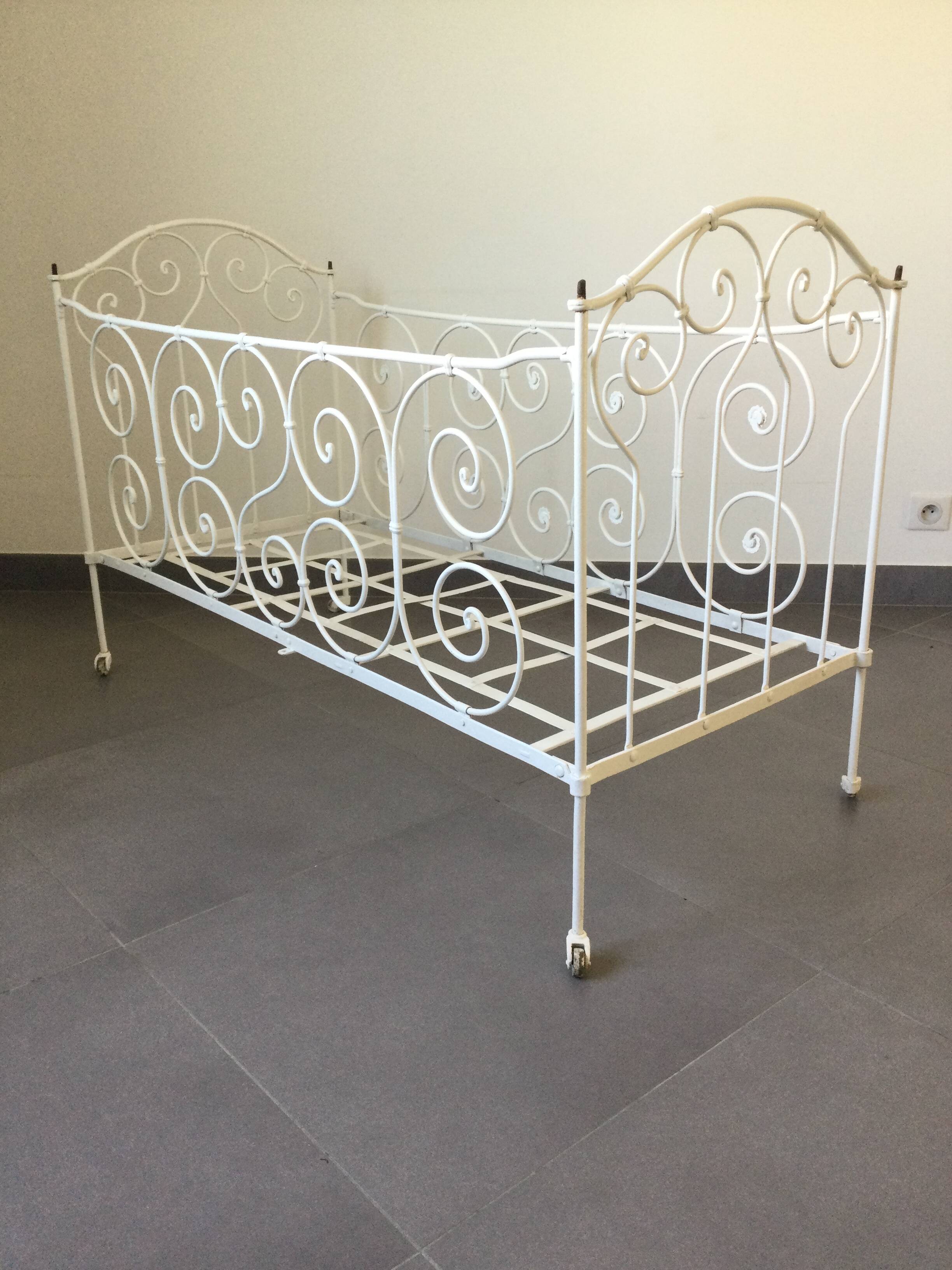 White wrought iron folding bed