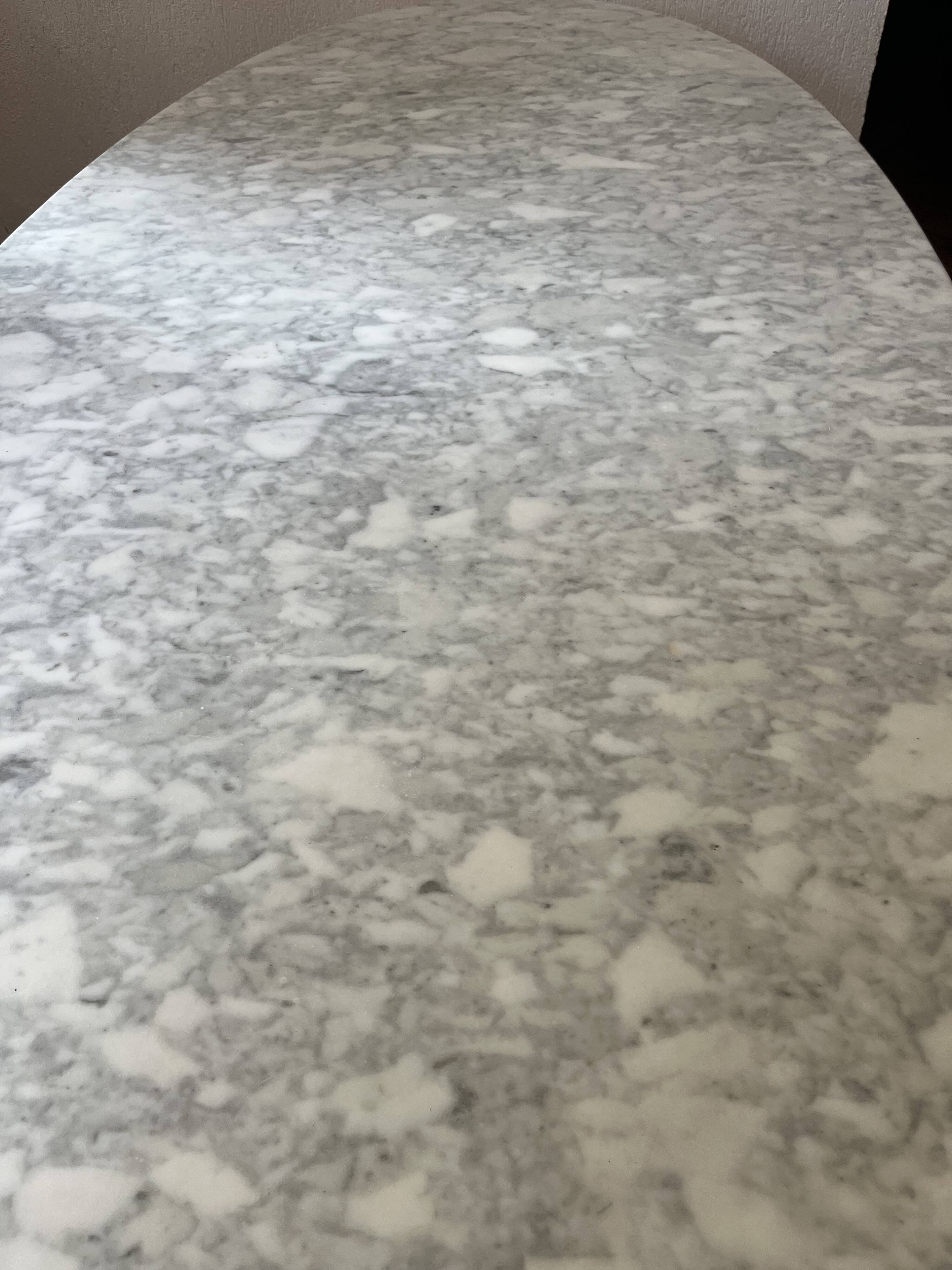 Oval table designed by Vittorio Introini, published by the Fratelli house.