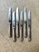 6 dessert knives by Christofle in silver-plated metal, shell decoration.