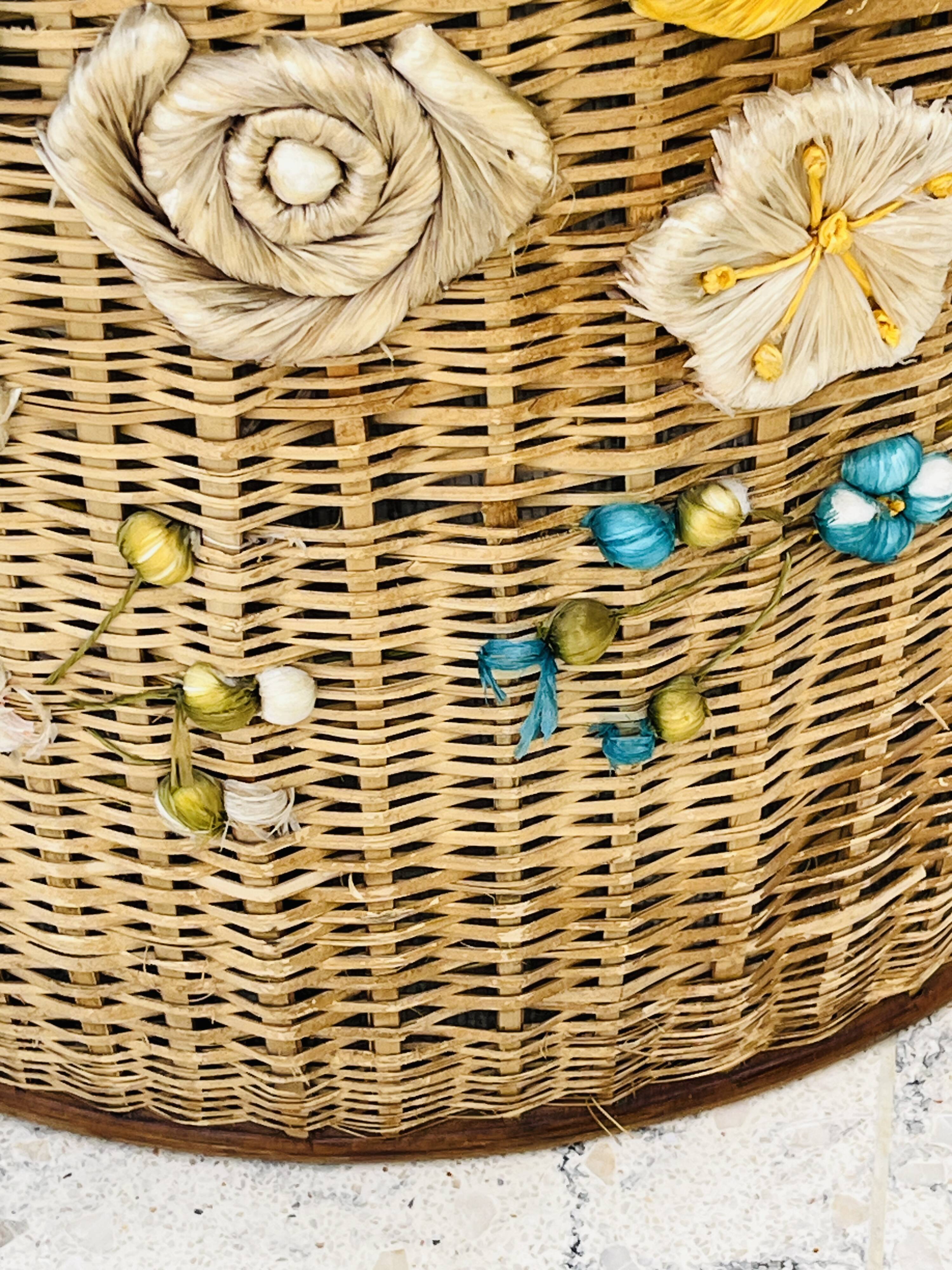 Vintage wicker mannequin with colourful floral decoration.