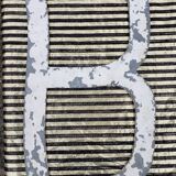 Letter B in galvanized metal