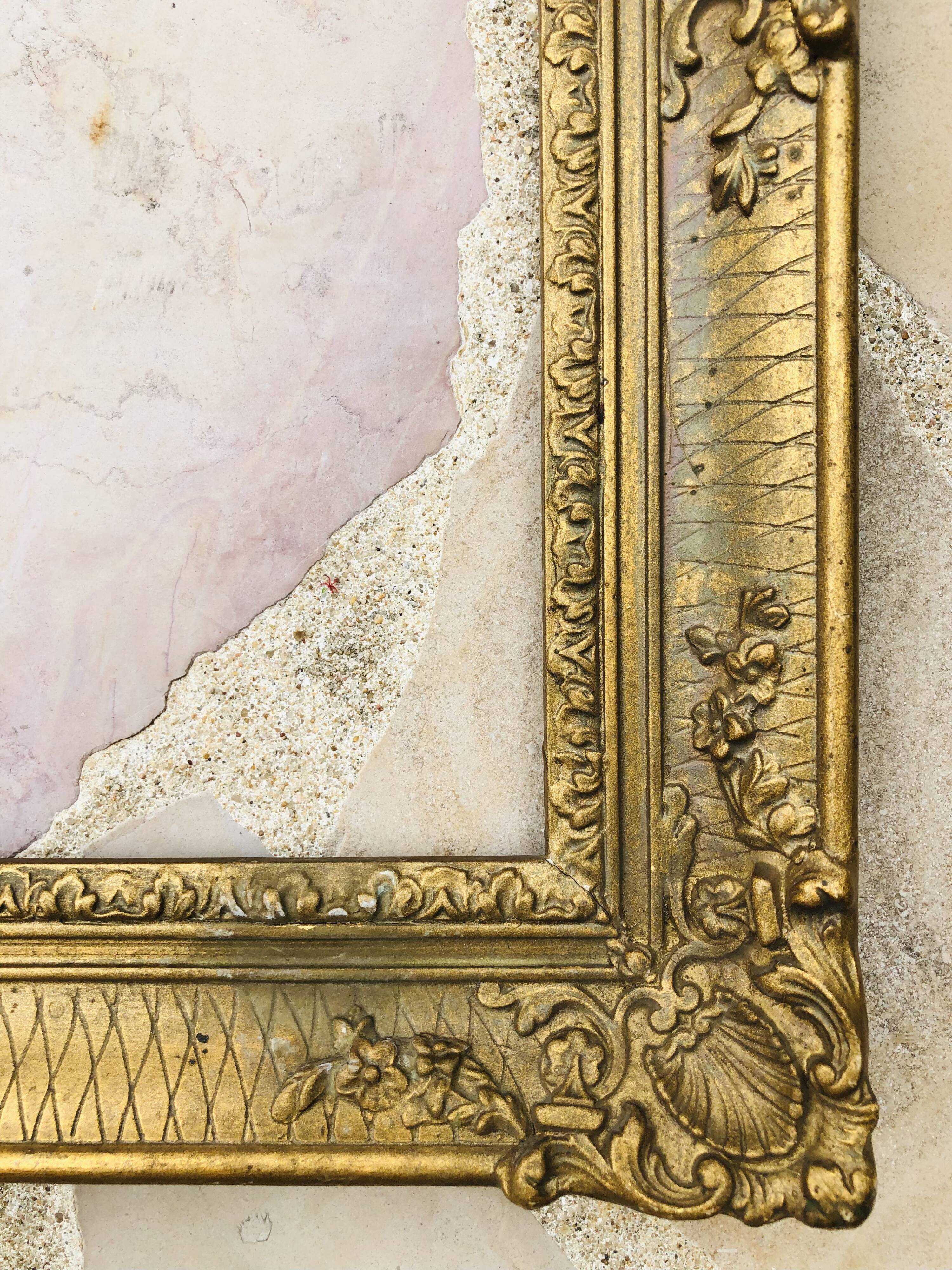 Old frame in gilded molded wood