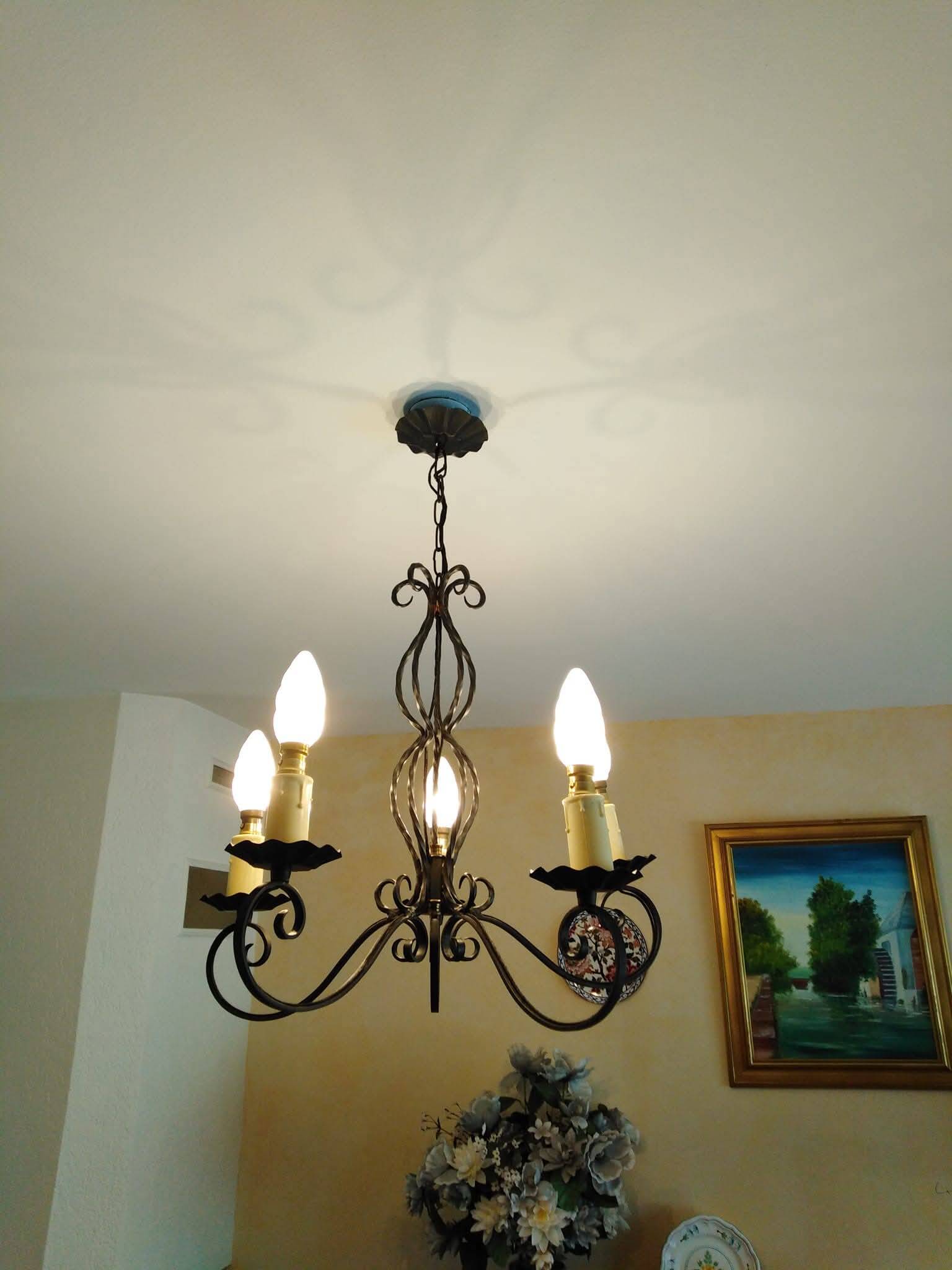 Antique wrought iron chandelier with 5 branches.
