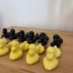Box of 12 dog-shaped cutlery rests in yellow and black majolica.