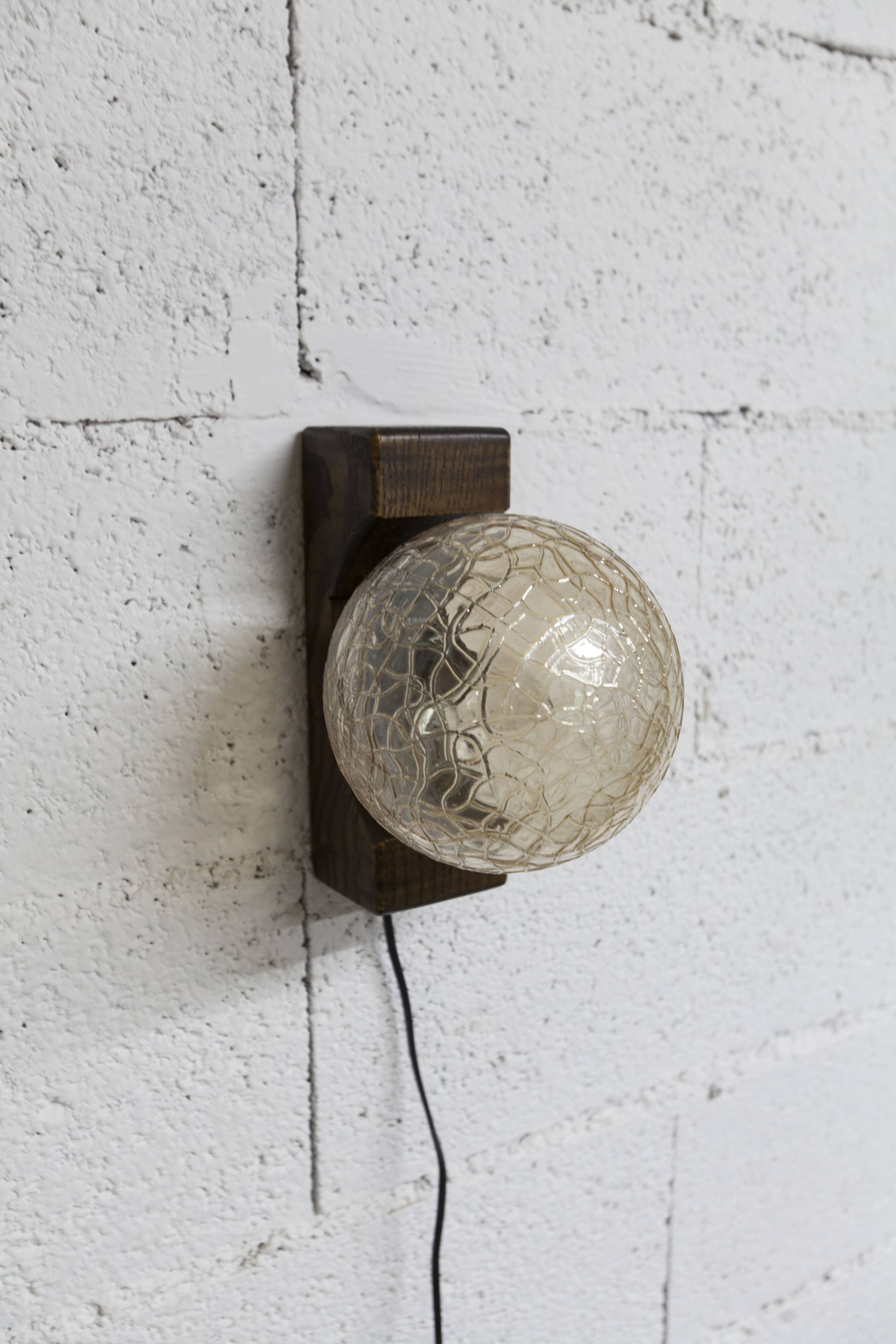 1960s ball wall light in dark wood and amber glass