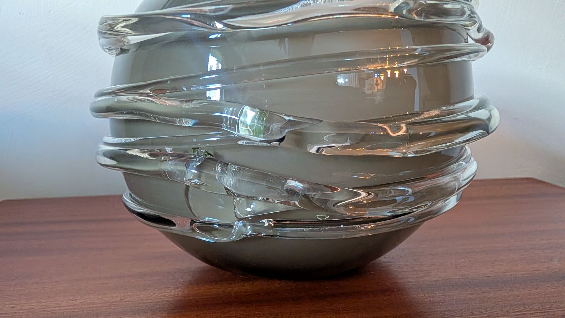 Smoky glass spherical vase with spiral applications from the 1970s.