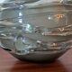 Smoky glass spherical vase with spiral applications from the 1970s.