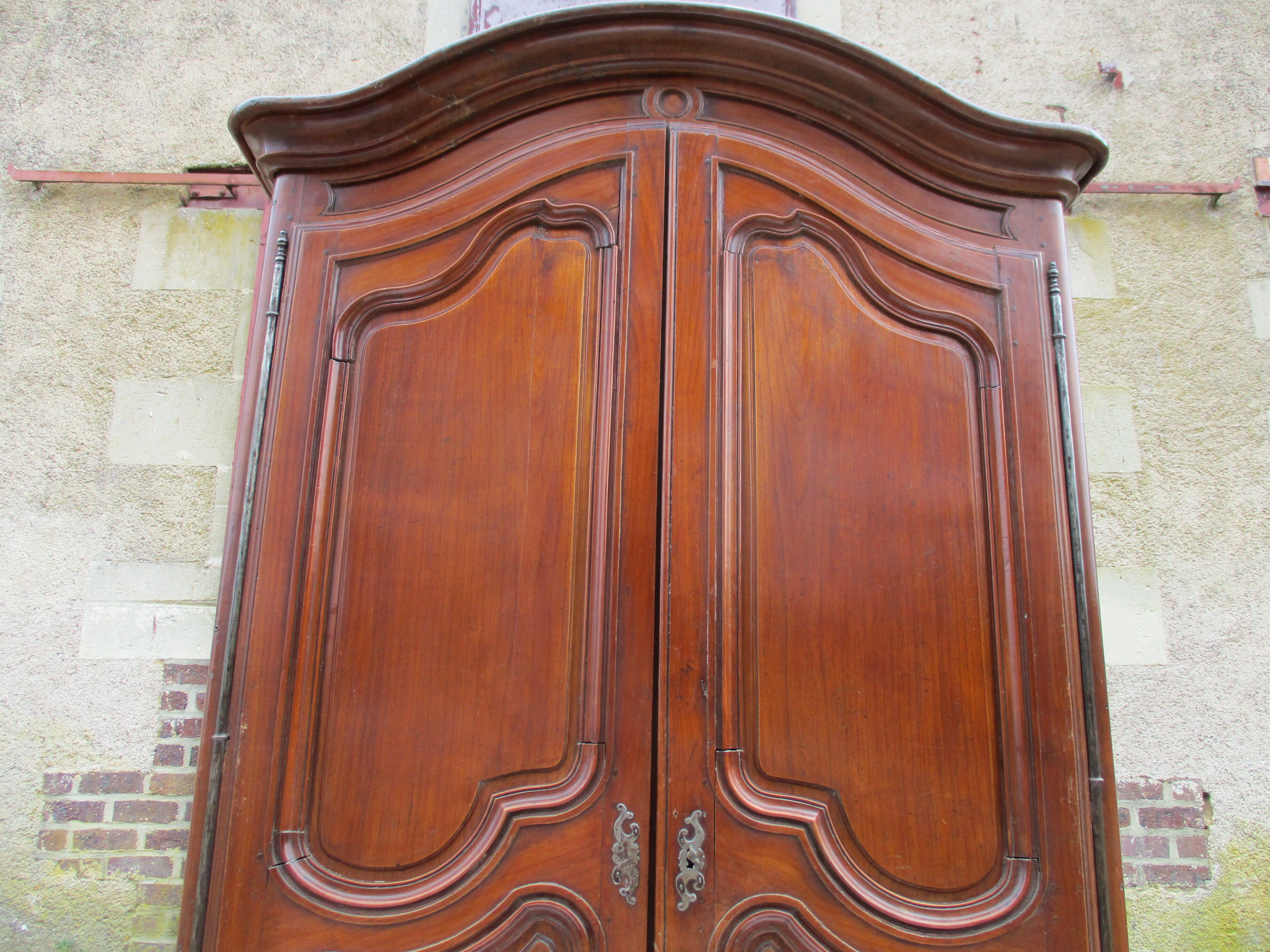 Small solid wooden cabinet with a gendarme hat