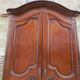 Small solid wooden cabinet with a gendarme hat