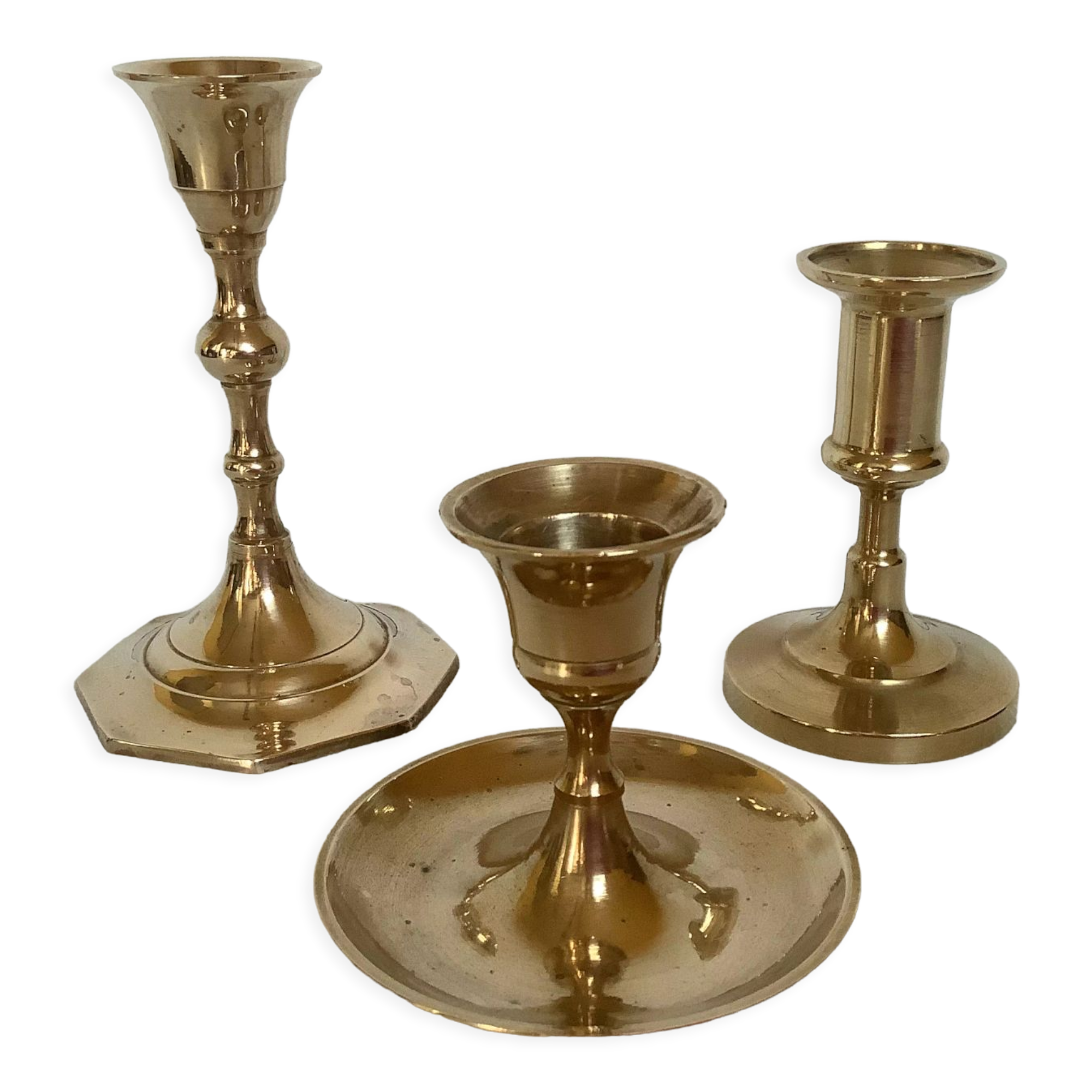 Trio of brass candle holders