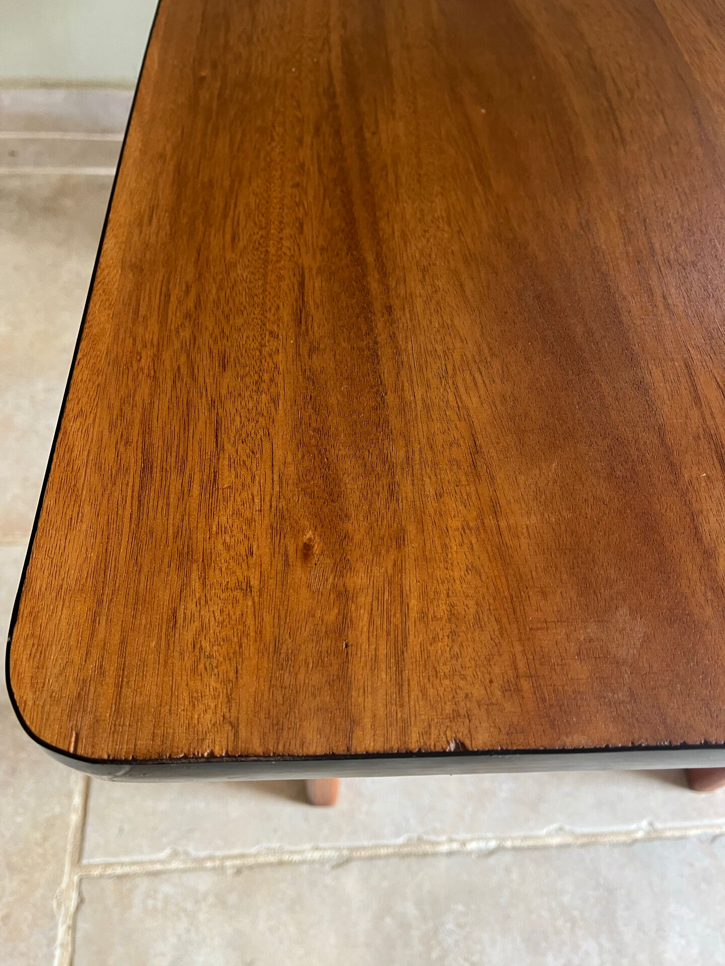 Mid-century coffee table with tapered legs.