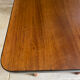 Mid-century coffee table with tapered legs.