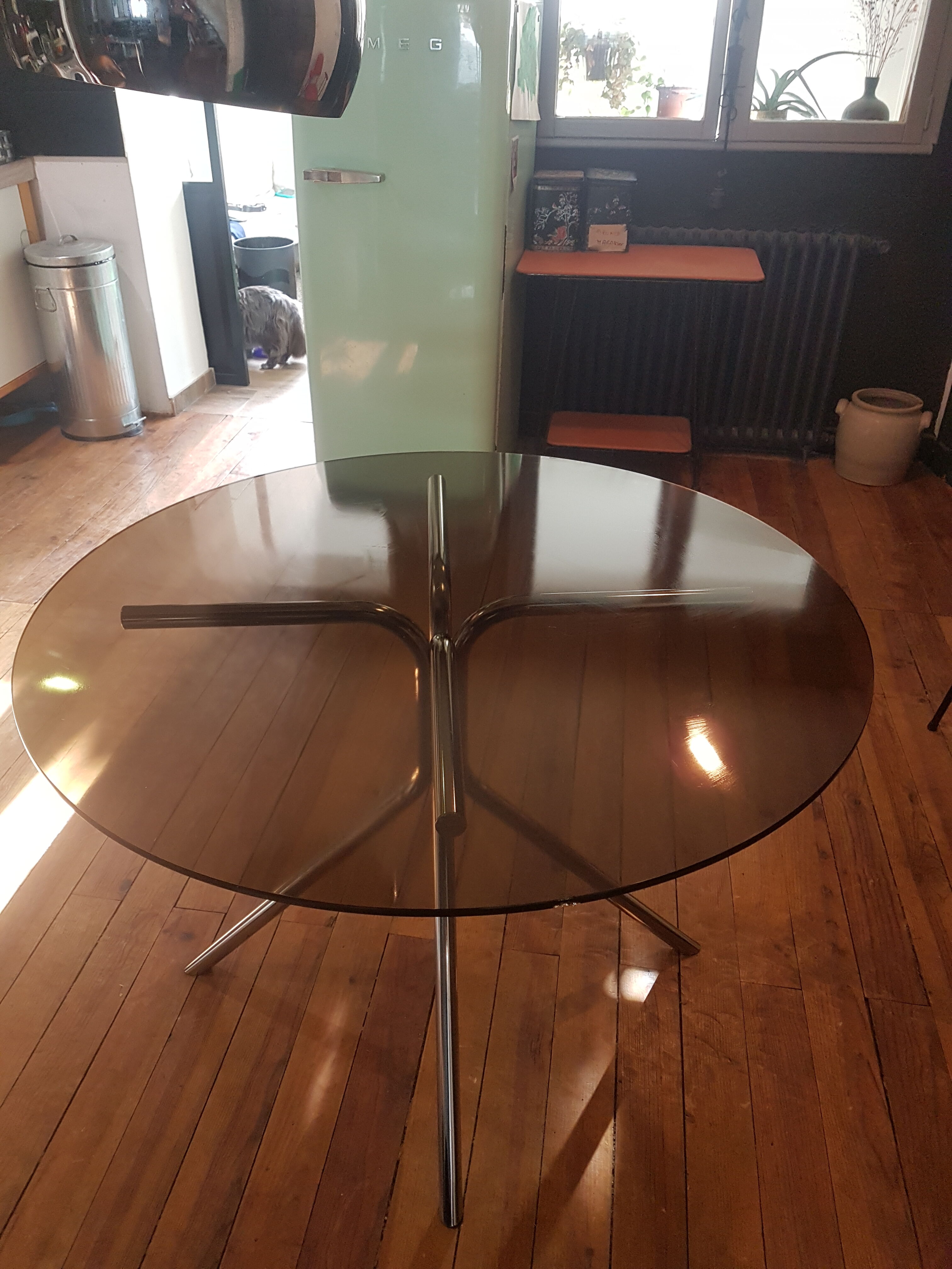 Smoked glass round table and chrome foot