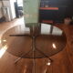 Smoked glass round table and chrome foot