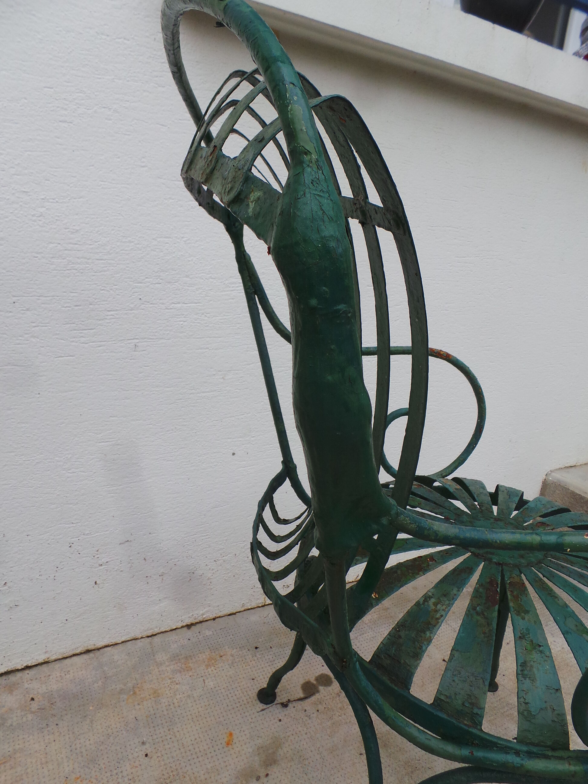 Pair of wrought iron garden chairs by François Carre