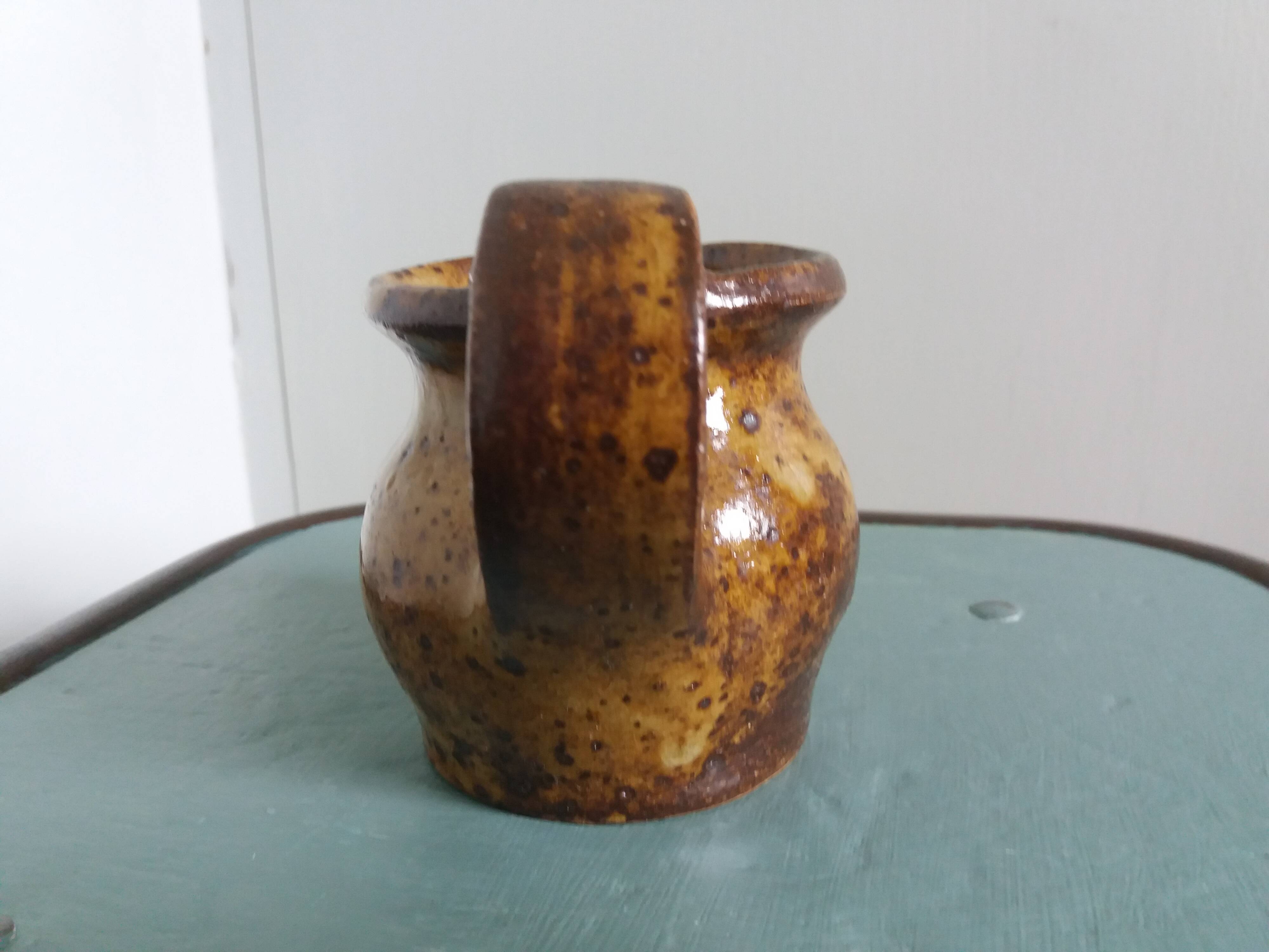 Stoneware pitcher signed cg