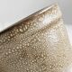 Gray and white speckled ceramic pot.