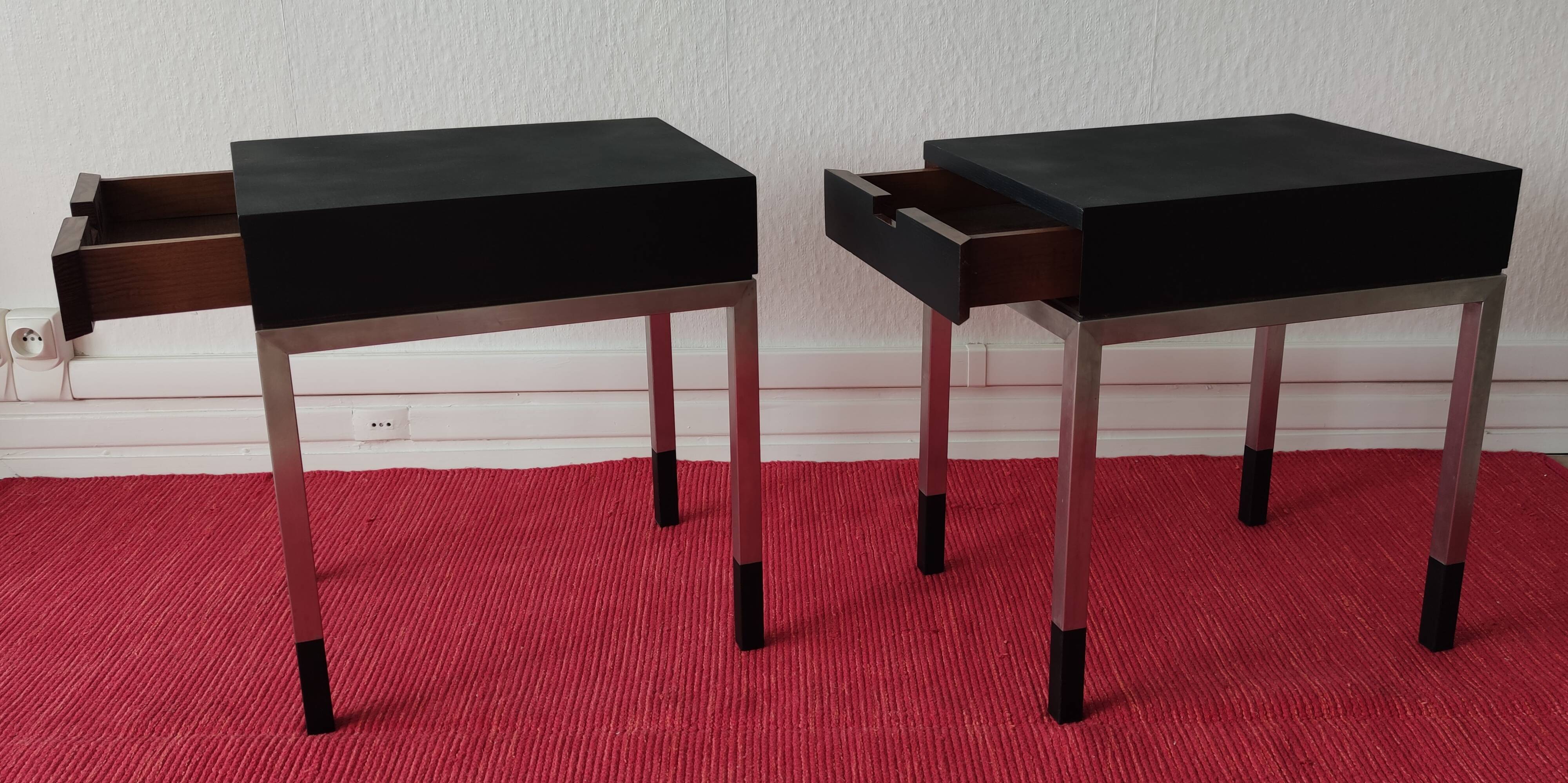 A pair of minimalist bedside tables