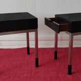 A pair of minimalist bedside tables
