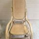 Rocking chair with a cane seat and backrest.