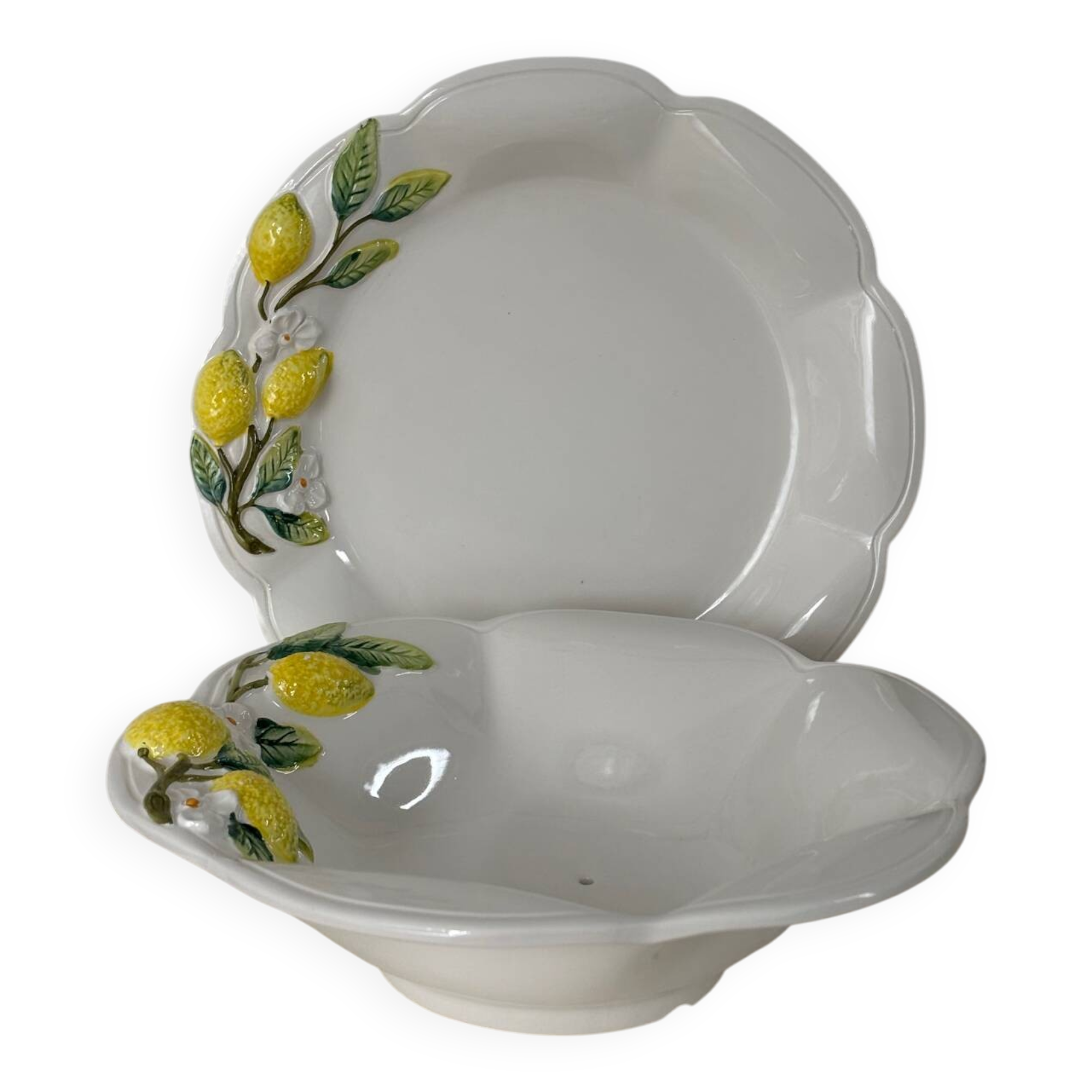 Plate and colander of lemons in slipware