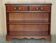 Vintage dwarf open library in hardwood with two drawers.