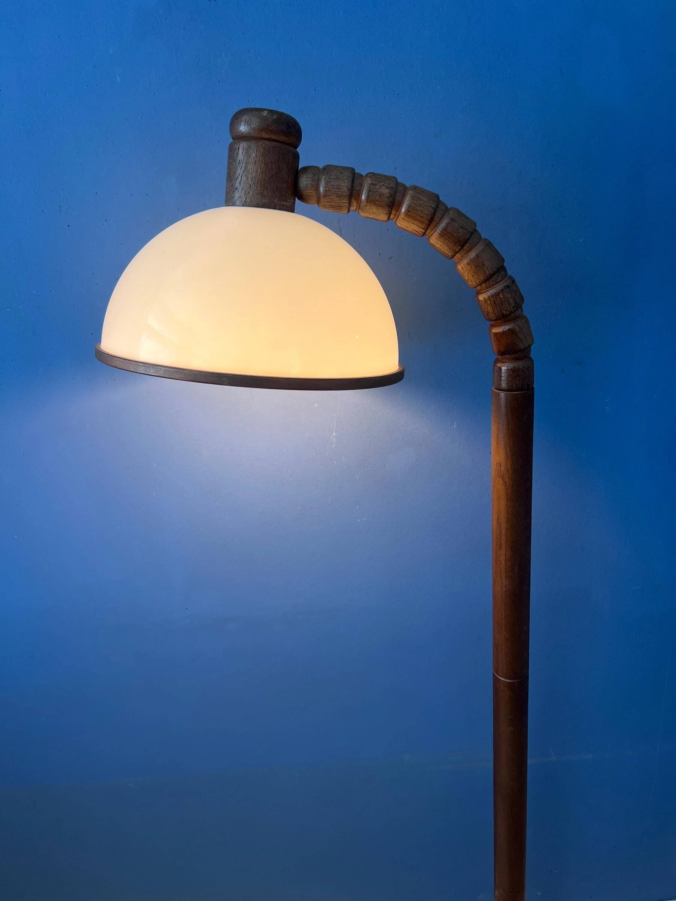 Mid-century floor lamp in brown wood by Steinhauer with an acrylic glass shade.