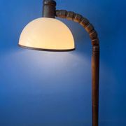 Mid-century floor lamp in brown wood by Steinhauer with an acrylic glass shade.