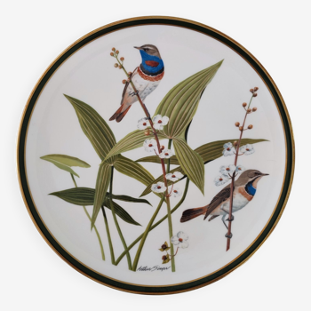 Porcelain plate, songbirds of the world, signed Arthur Singer.