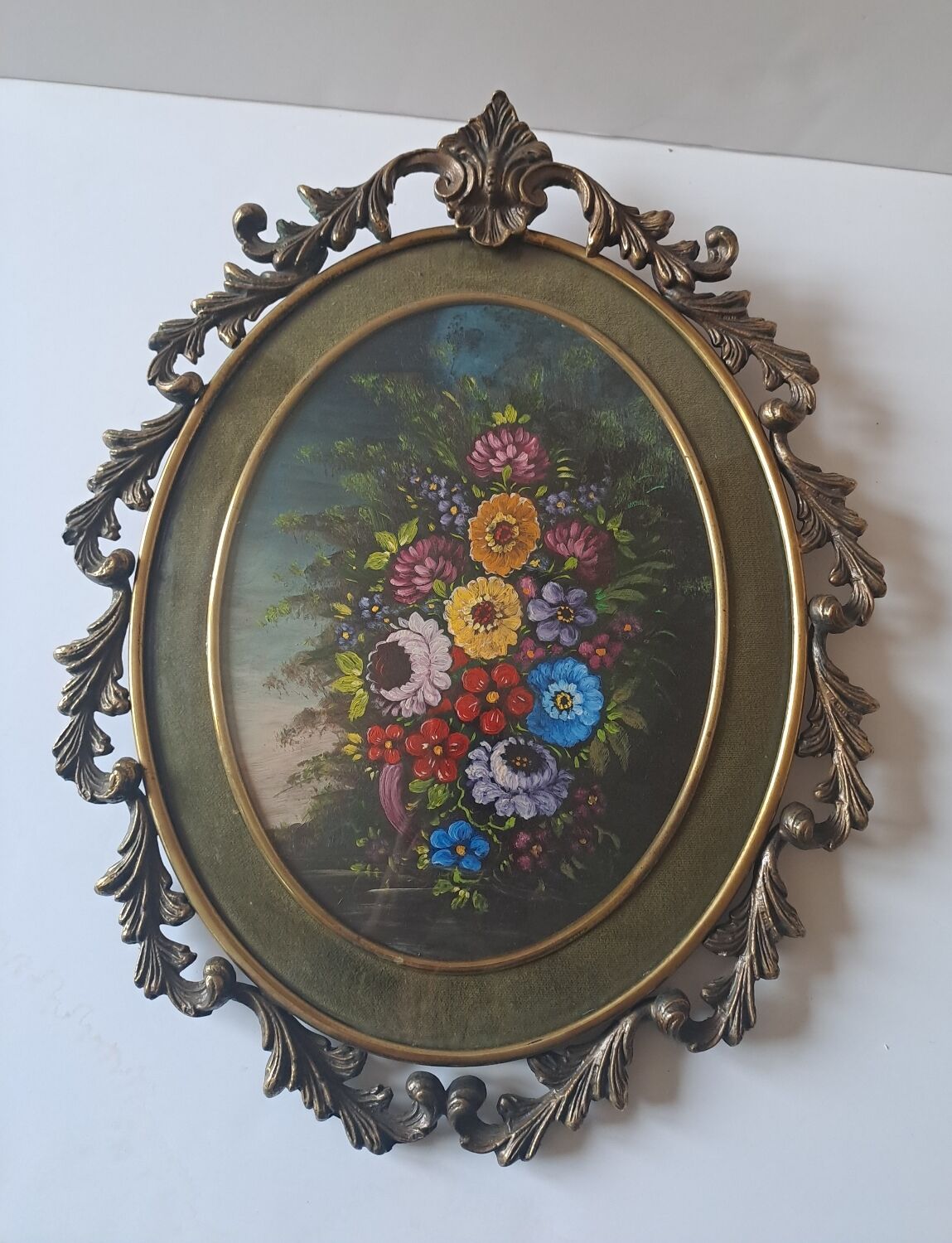 Painted under glass convex medallion in bronze
