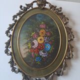 Painted under glass convex medallion in bronze