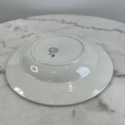 Set of 7 deep plates in earthenware, decorated with a green frieze.