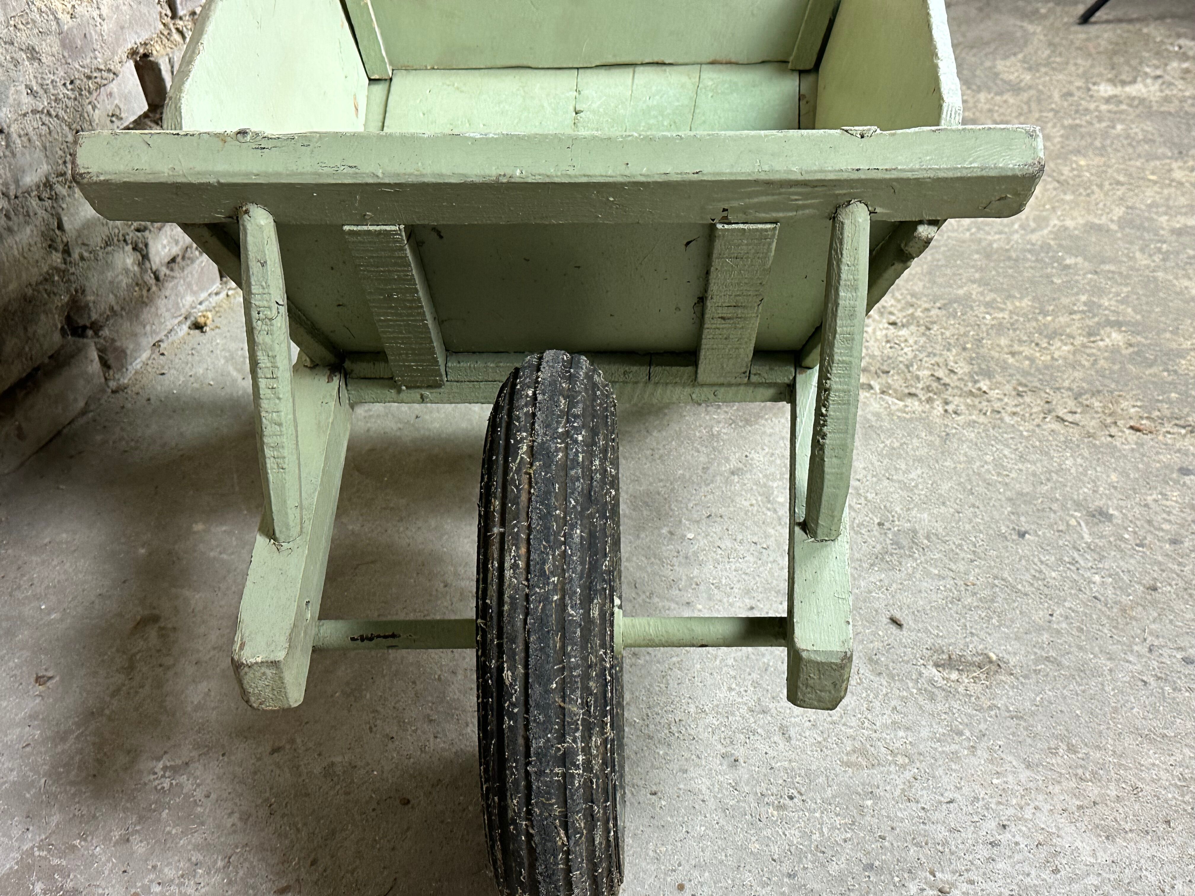 Antique wooden wheelbarrow