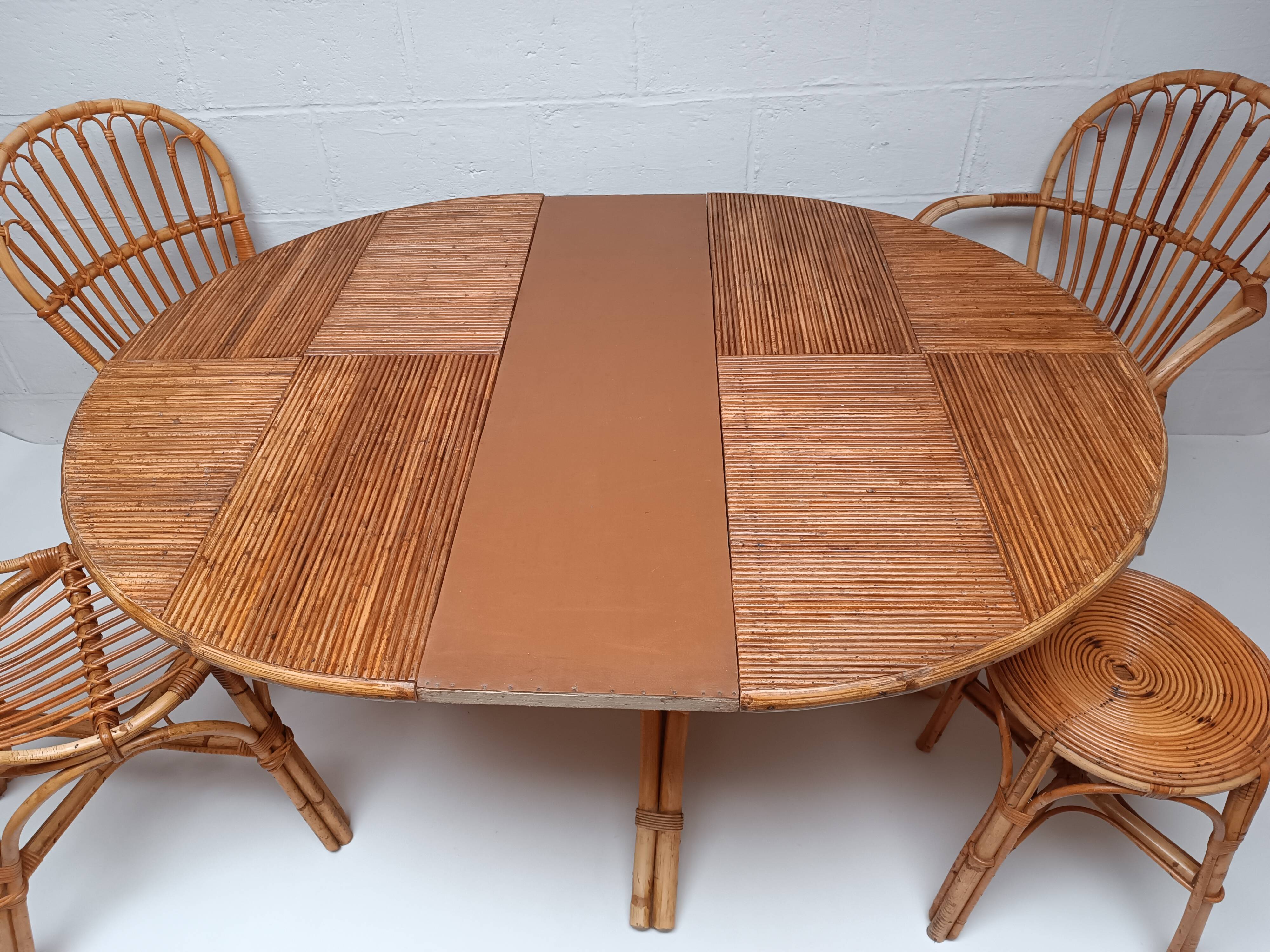 Bamboo table with extensions, 3 chairs and 3 stools from the 1960s.