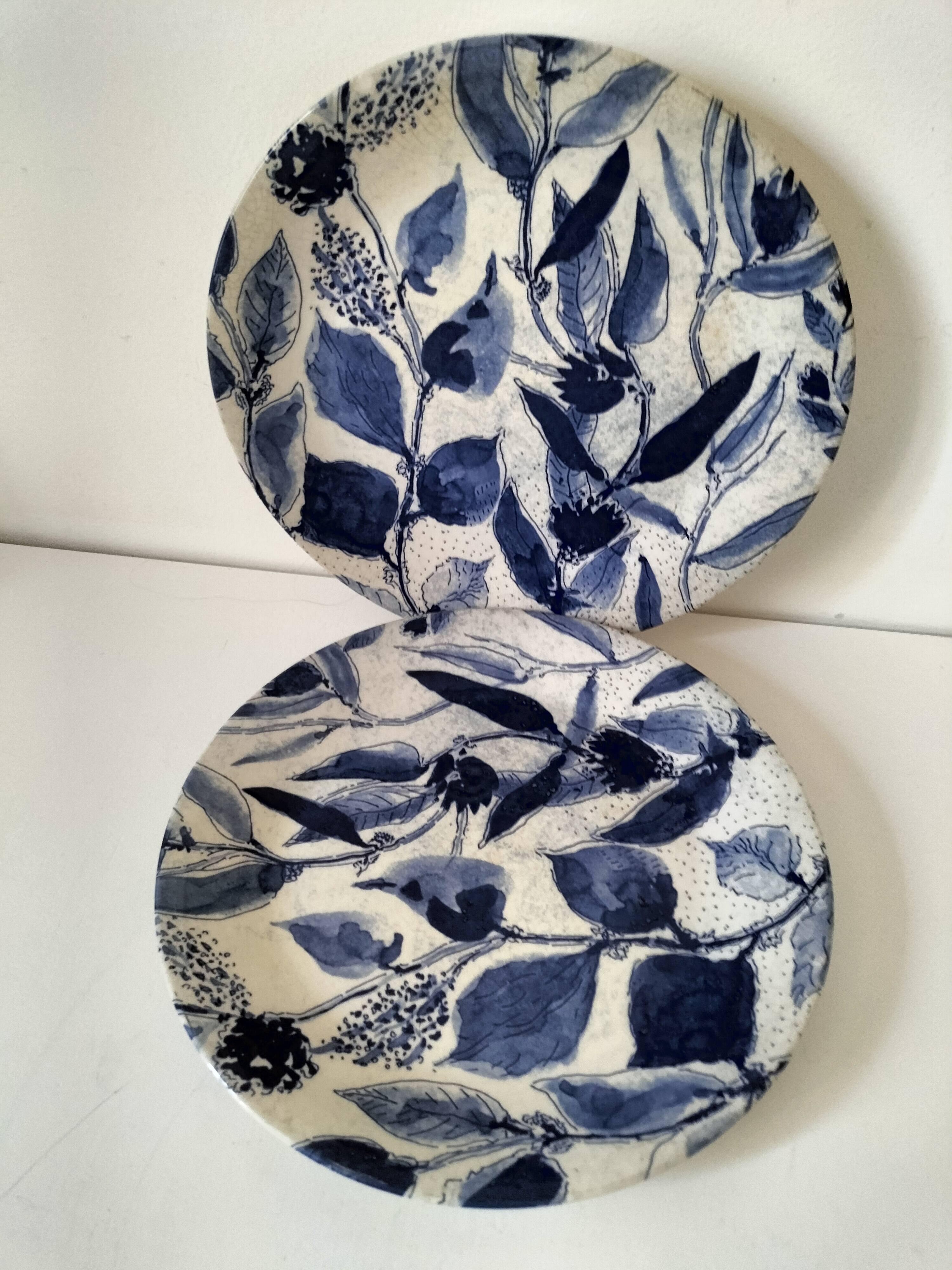 Two flat plates in earthenware with blue floral decoration.