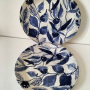 Two flat plates in earthenware with blue floral decoration.