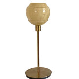 Table lamp with an antique vintage glass lampshade, between gold and camel, with a golden foot