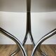 Set consisting of a table in chrome and smoked glass and its 4 tubular chairs in chrome and skaï a