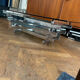 70s design coffee table in rectangular glass with chrome legs.