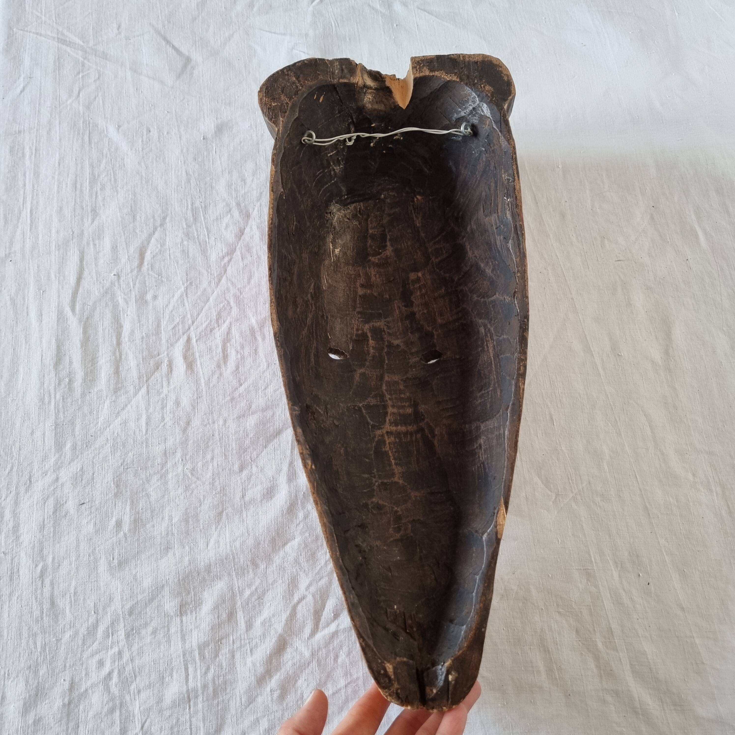 Wooden mask baule carved and hand painted with natural pigments from ivory coast