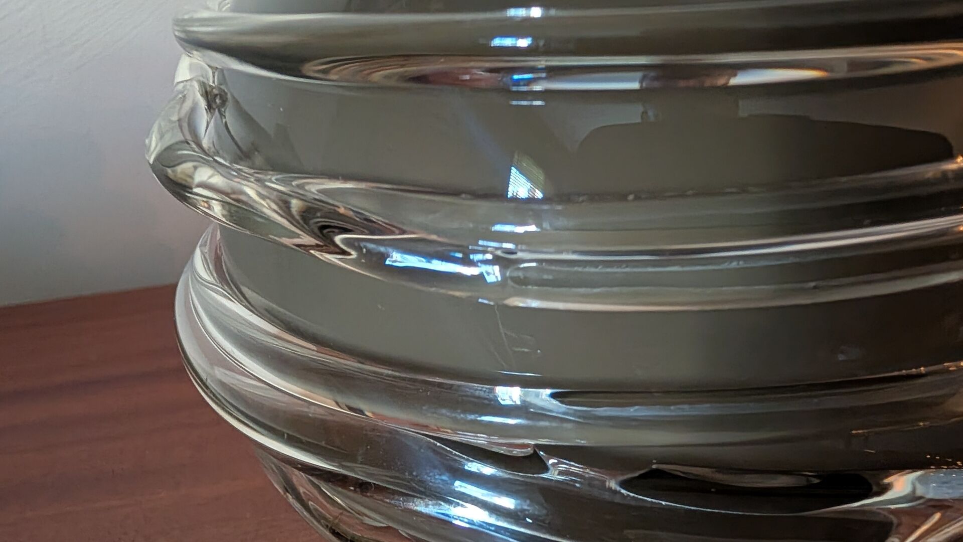 Smoky glass spherical vase with spiral applications from the 1970s.