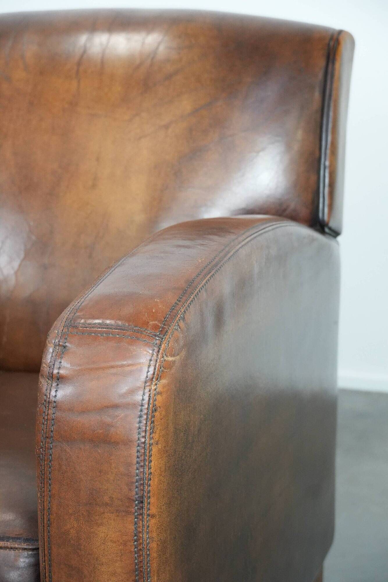 Characterful set of two vintage sheepskin armchairs with beautiful colours