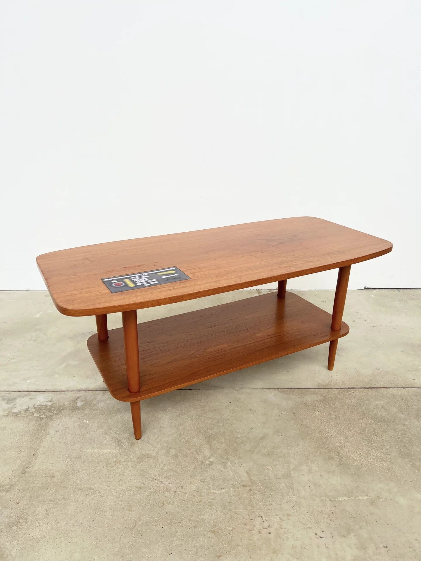 Teak coffee table with double top and ceramic insert — Scandinavian, 1960s