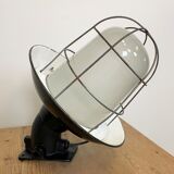 Industrial black enamel and cast iron wall lamp with iron grid, 1960s