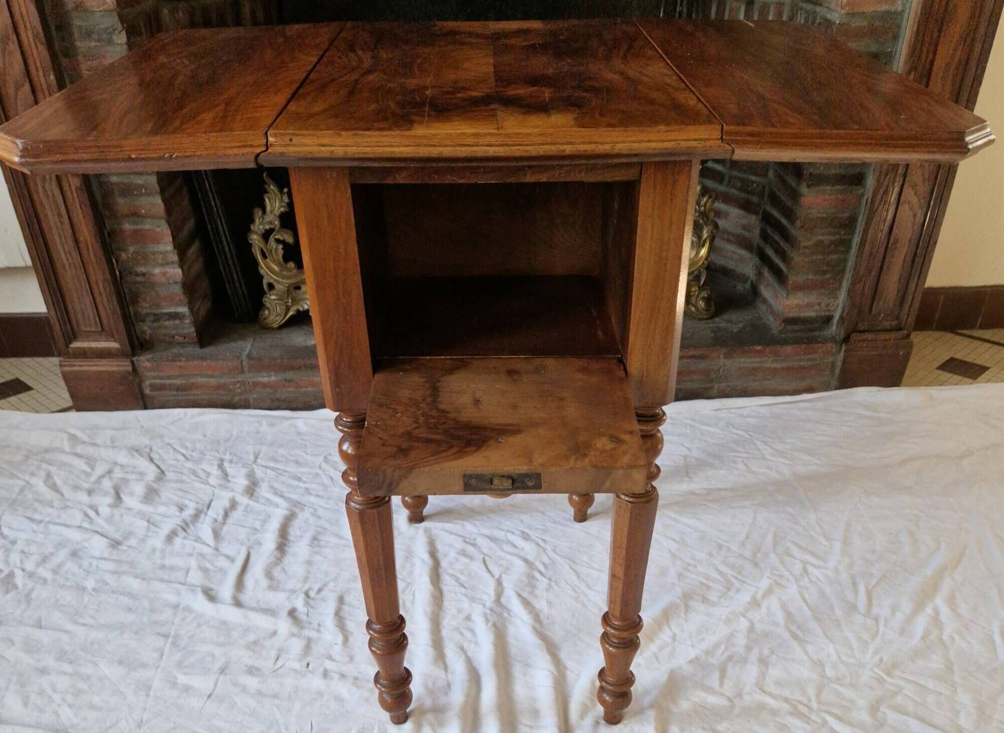Nineteenth-century walnut work table with flaps, large storage + secret drawer.